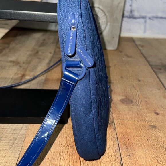 Michael Kors Mono Embossed Neoprene iPad Crossbody Purse Bag
Padded blue - Picture 6 of 16